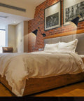 Bedroom showing Vintage Industrial Wall Sconce Light Set of Two With Adjustable Swing Arm in Bronze Finish