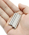 Hand holding 30Pcs M4 40Mm Stainless Steel Dowel Pins Set For Shelf Support And Furniture Pegs Unthreaded Cylindrical Dowels