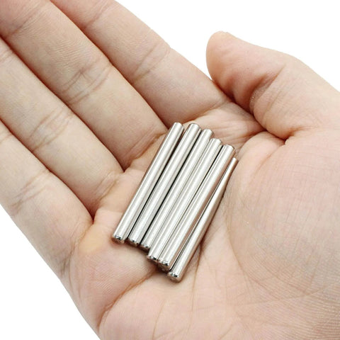 Hand holding 30Pcs M4 40Mm Stainless Steel Dowel Pins Set For Shelf Support And Furniture Pegs Unthreaded Cylindrical Dowels
