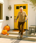 Elderly man using Heavy Duty Black Wrought Iron Single Step Handrail Rust Resistant In Ground Stair Railing For Porches And Decks.