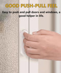 Hand using Four Clear PU Self Adhesive Recessed Finger Pulls 7.5x2.5 Cm Oval Sliding Door Handles for glass window installation