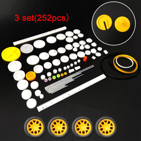 18 Piece 3V DC Motor Kit For STEM Projects And Toys With 24000 RPM Gear Train 252 Plastic Gears Includes 2 AA Battery Holder And Wires Kid Friendly Fun Hands On Learning Set, showing 252 plastic gears and wheels on black background