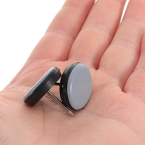 Hand holding two 12 Piece Nail On Chair Leg Sliders For Hardwood Floors Heavy Duty Plastic And Metal Floor Protectors Easy Install.