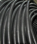 Close-up of black 1 Inch Split Loom Tubing 20 Feet, flexible wire conduit hose for automotive marine hydraulic wiring protection.