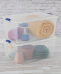 Extra Large Clear Storage Bin with Lid Stackable Plastic Tote showing camping gear and plant pots in a transparent design.