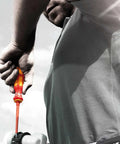 Person using Kraftform Kompakt VDE Changeable Blade Set with 18 Interchangeable Blades, focusing on handle and blade in action.