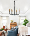 Modern Farmhouse Black And Gold 6 Light Candle Chandelier With Adjustable Height Chain And Rods Ceiling Light Fixture in bedroom