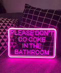 Please Dont Do Coke In The Bathroom 3D Art Carving Neon Sign Pink LED USB Wall Decor on couch with geometric pillows