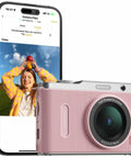 Fire Pink Wifi Digital Camera For Kids Featuring Switchable Dual Lenses And Crisp 4K Capture Point And Shoot Option With Sixteen X Zoom Anti Shake Tech Super Portable Compact Design Prime Gift For Cool Teens with a smartphone displaying captured images.