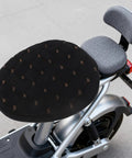 Top Shelf Comfort Plush Electric Scooter Seat Cover Winter Warm Black Stays Put Quick Strap Kit on an electric scooter seat.