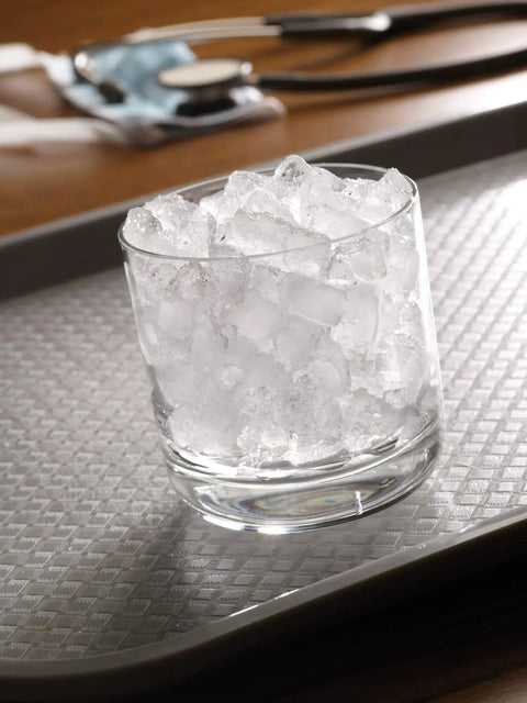 Heavy-Duty Commercial Nugget Ice Maker, Air Cooled Stainless Steel Exterior, Cranks Out Up To 343 Lbs Of Fresh Ice Daily, Boasts A Handily Sized Storage Bin, Countertop Ready - glass with nugget ice on a textured tray.