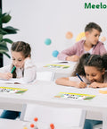 Children in a classroom using clear reusable nameplate pockets, 25 pack, 9.5 x 3.4 inches, on their desks.