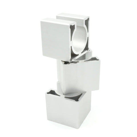 Three white aluminum NEMA23 motor mount brackets with circular bore holes