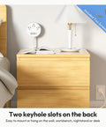 Flat Plug Power Strip With USB Ports And Wall Mount For Dorm And Office Use, shown mounted on a wooden nightstand.