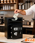 Someone depositing cash into the Front Drop Slot Deposit Safe Fireproof With Digital Combination Anti Fishing Safe Box in a cafe.