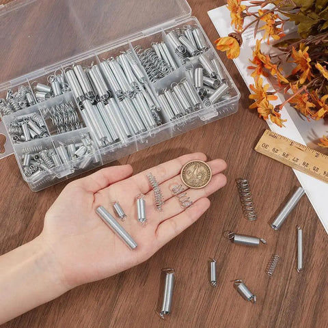 300Pcs Extension And Compression Spring Assortment Kit With 20 Sizes Carbon Steel Small Metal Springs For Home Repairs Tools DIY Craft Projects And Mechanical Repair Replacement Sets, clear case and hand-held springs