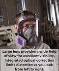 Person wearing Reusable Full Face Mask Respirator For Vapors And Particles Grey Medium Size in a workshop setting