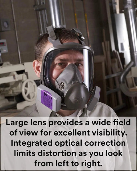 Person wearing Reusable Full Face Mask Respirator For Vapors And Particles Grey Medium Size in a workshop setting