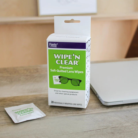Front view of Flents Wipe N Clear lens wipes box and a single sachet, 20-count package with green front panel.