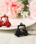 Two Piece Golf Keychains Set In Zinc Alloy Durable Golf Cart Key Ring With Golf Themed Design A Fun Souvenir For Players And Fans Black And Red Dope Gift For Golfers And Collectors on a floral background
