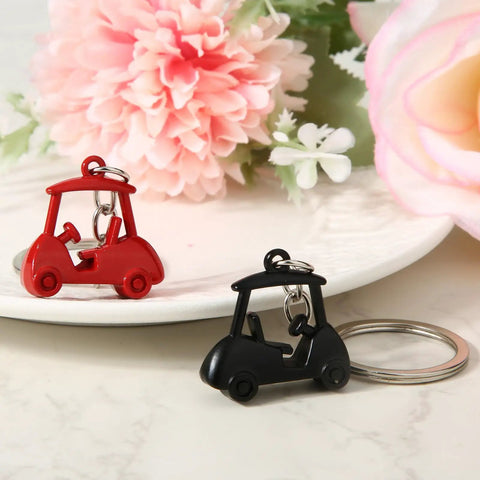 Two Piece Golf Keychains Set In Zinc Alloy Durable Golf Cart Key Ring With Golf Themed Design A Fun Souvenir For Players And Fans Black And Red Dope Gift For Golfers And Collectors on a floral background