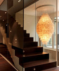 Simple Modern Shell Ceiling Pendant Light With Washed Linen Shade For Dining Room Bedroom Entryway And Foyer illuminating a staircase.