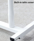 Detail of the built-in corner on the No Sweat Height Adjustable Laptop Desk, featuring sturdy white metal construction.