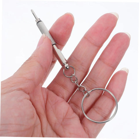 Mini screwdriver from the All In One Eyeglasses Repair Kit With Silicone Nose Pads, Mini Screwdrivers, Tweezers And Tiny Screws For Quick Eyewear Fixes And Comfortable Wear Great For Travel And Daily Repairs, Easy To Use At Home Or On The Go, held in a hand.