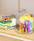 Clear acrylic Lazy Susan turntables with cleaning supplies on kitchen counter; Three Pack Lazy Susan Turntable Organizer For Kitchen Storage Rotating Spice Rack Clear Acrylic 9.25, 10.6, 12 Inches Pantry Cabinet Fridge Countertop Condiment Holder For Spices Seasonings Snacks Easy Spin