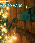 Green 50 Ft Outdoor Extension Cord Waterproof 16 AWG SJTW flexible on brick wall powering hanging string lights