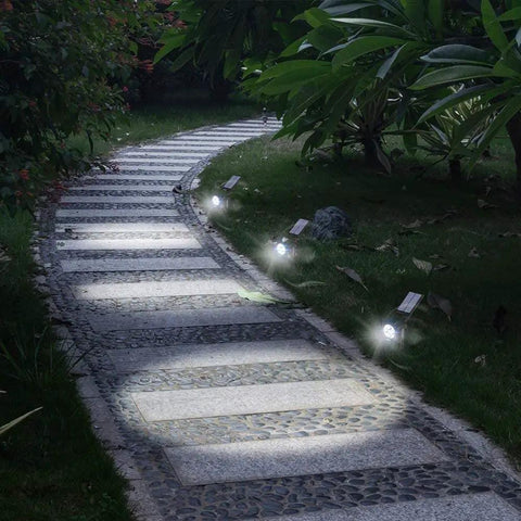 Ultra Bright Solar Spotlight 200 Lumen With 270 Degree Adjustable Waterproof Outdoor Landscape Light illuminating walkway
