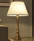 Spyglass Table Lamp With Antique Brass Finish Dope Retro Modern Classic Vibe Linen Shade 30.5 Inch Tall bedside view.