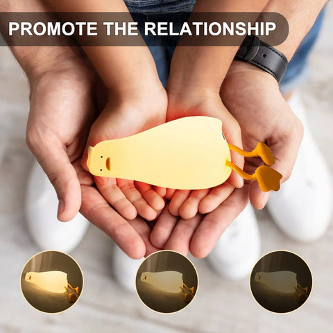 Hands holding Night Light Duck Shaped LED Lamp For Kids And Nursing Touchable Silicone Lie Flat Baby Duck Dimmable Timed Bedside Lamp Rechargeable Battery Gentle Glow Nightlight For Nursery And Girls Bedroom Decor