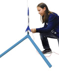 Child setting up rocket on PS II Model Rocket Launch Pad For Mid Powered Rockets Ready To Blast Off With A 60 Inch Threaded Steel Launch Rod PVC Leg System And A 5 Inch Galvanized Mount Essential Rocket Kit Accessory For Ages 10 And Up