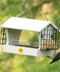 Medium Hopper Bird Feeder With Dual Suet Cages; metal mesh feeder with bird eating suet outdoors in a garden setting.
