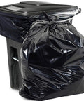 Heavy Duty 95 And 96 Gallon Garbage Bags 50 Pack With Bulletproof 2 Mil Thickness For Toter Drums Contractor Sites And Yard Waste Cleanup In A Rugged Tear Resistant Build That Saves Your Hard Earned Cash Quick with a black trash bag beside a container