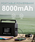8000mAh portable power bank with digital display and multiple output ports, devices charging in outdoor setting