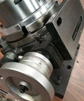 Heavy Duty Eight Inch Precision Tilting Rotary Table With No Fuss Zero To Ninety Degree Tilt Capability And Four Jaw Self Centering Chuck Setup For Dead Straight Mill Projects close-up of the dial and chuck.