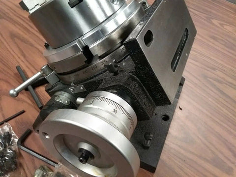 Heavy Duty Eight Inch Precision Tilting Rotary Table With No Fuss Zero To Ninety Degree Tilt Capability And Four Jaw Self Centering Chuck Setup For Dead Straight Mill Projects close-up of the dial and chuck.