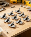 Soft Close Cabinet Hinges Set For Kitchen Cupboards on a workbench with tools, featuring precision matched holes, no drill install.