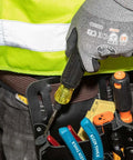 Person holding 6 In 1 Tapping Tool From Klein Tools With Cushion Grip for Repairing Threads, attached to tool belt