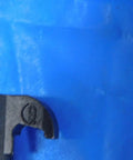 Close-up view of Premium Grind CL-9 Insert Clamp for Indexable Cutting Tools, showing secure locking feature on blue background.