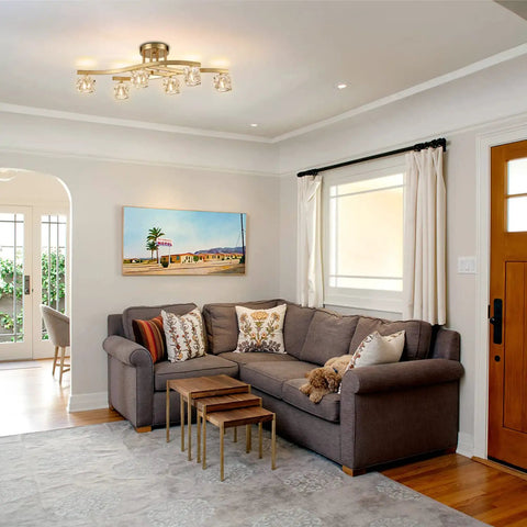 Modern Crystal Ceiling Light Fixture With Brushed Nickel Finish And Ice Cube Glass Shades in cozy living room setting.