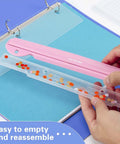 Using the Pink 3 Hole Binder Punch, Compact Desk Tool With 5 Sheet Capacity, showing easy chip tray removal for office organization.