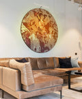 14 Inch Picture Light With Integrated LED 3000K Warm White 4W (40W Eqv) Metal Wall Mount Artwork Display Light CRI90 96 Inch Cord With In Line On Off Switch Brushed Nickel Finish illuminating circular wall art above a brown sofa in modern living room.