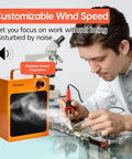 Heavy Duty HEPA Solder Fume Extractor Fan With Activated Carbon Double Filter, compact orange blower at DIY workstation.