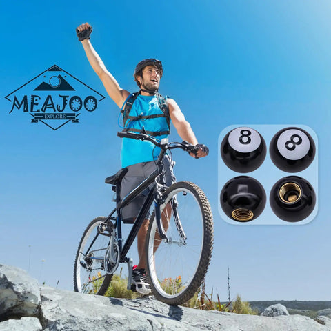 Man with bicycle next to 8 Ball Pool Style Tire Valve Stem Caps 4 Pack Universal Copper Core Dustproof Caps Black ABS