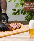 Person using BBQ Glove Set With Four Cotton Liners And One Hundred Black Nitrile Gloves For Grillin And Food Prep, Heat Resistant.