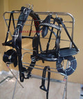 Black Leather Adjustable Horse Driving Harness for Single Horse Cart with Padded Girth, full view on rack.
