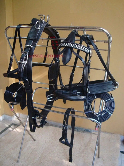 Black Leather Adjustable Horse Driving Harness for Single Horse Cart with Padded Girth, full view on rack.